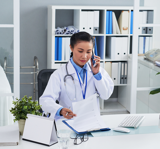asian-female-doctor-talking-mobile-phone