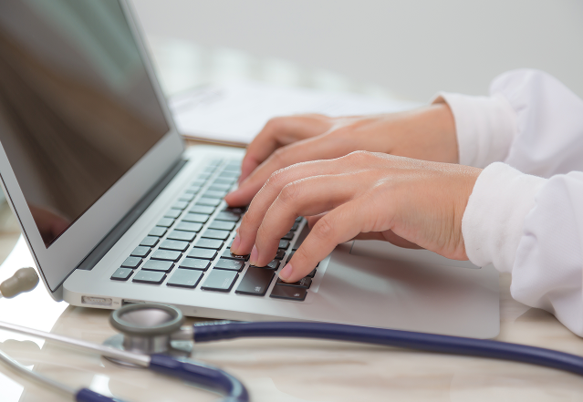 busy-doctor-using-laptop